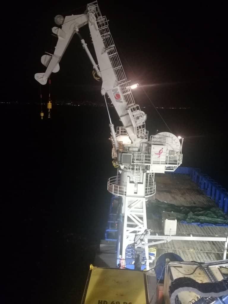 Night offshore crane operation on deck