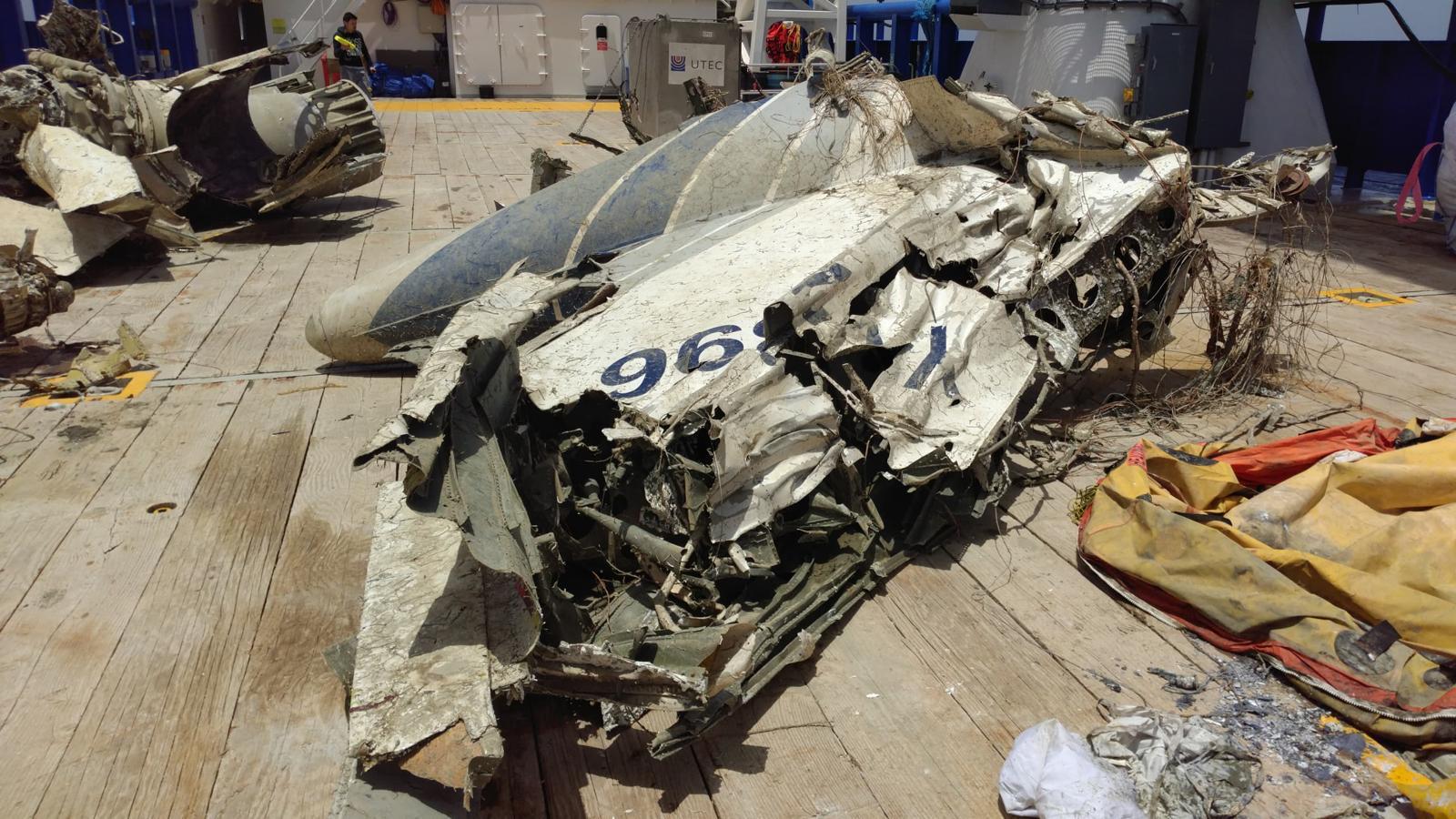 Recovered aircraft fuselage section on vessel deck